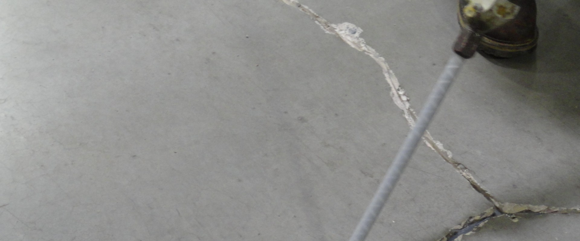 Are there any special techniques for repairing cracks or holes with repair glue grounded on certain materials?
