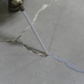 Are there any special techniques for repairing cracks or holes with repair glue grounded on certain materials?